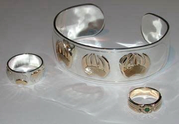 Appliqued-Bracelets - BA2 single 14k gold Grizzly paw appliqued on 1" wide silver 